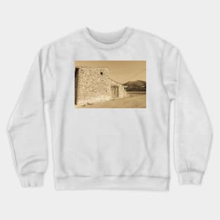 Old stone building with dilapidated wooden doors Crewneck Sweatshirt